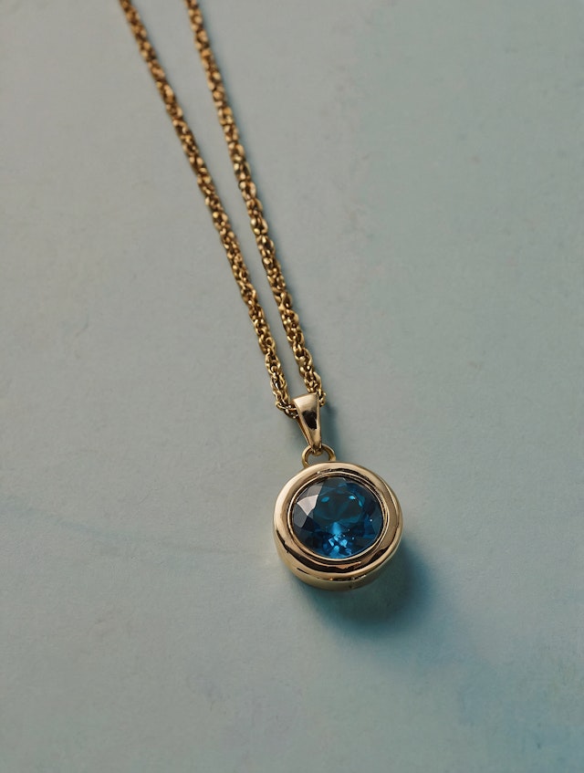 Gold Necklace with Blue Gemstone Pendant