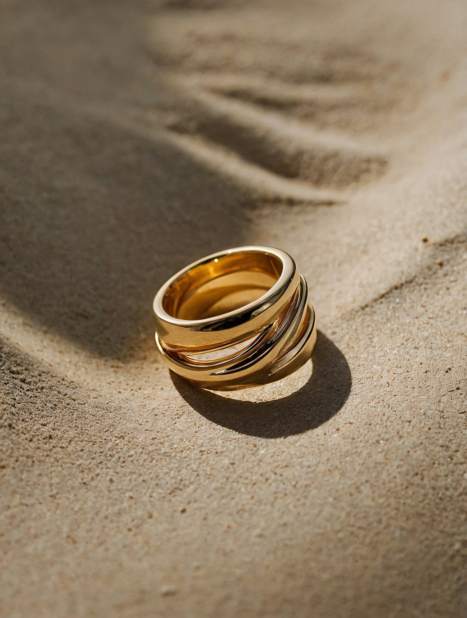 Gold Ring on Sandy Surface