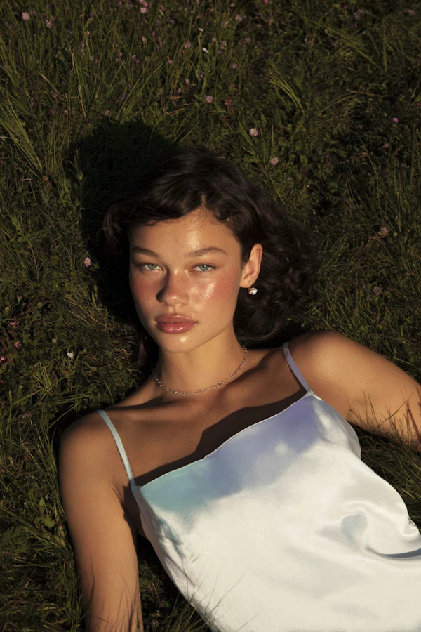 Woman in Grassy Field