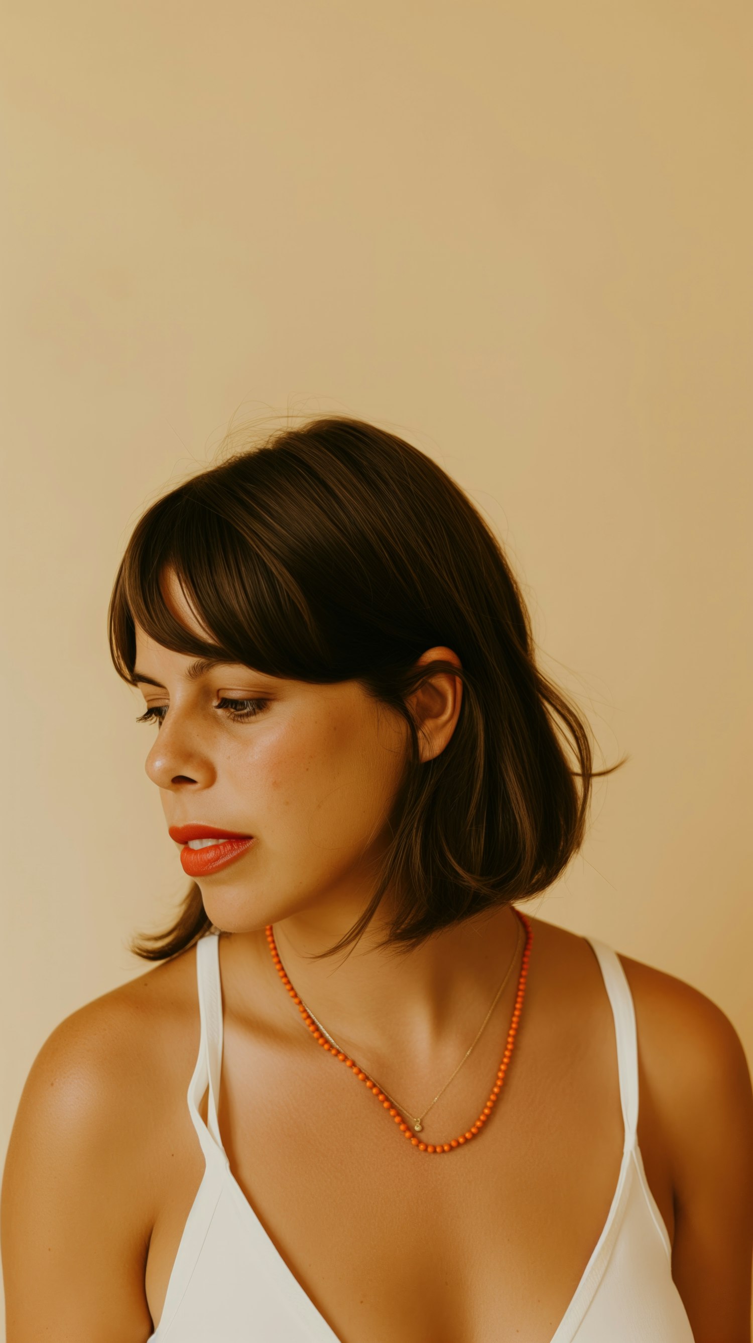 Serene Young Woman with Orange Necklace