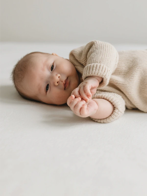 Baby in Knitted Outfit