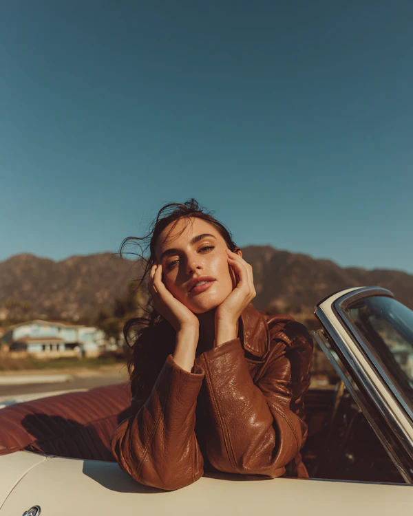Woman by Convertible Car