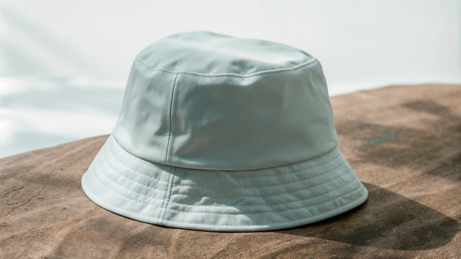 Light-Colored Bucket Hat on Textured Surface