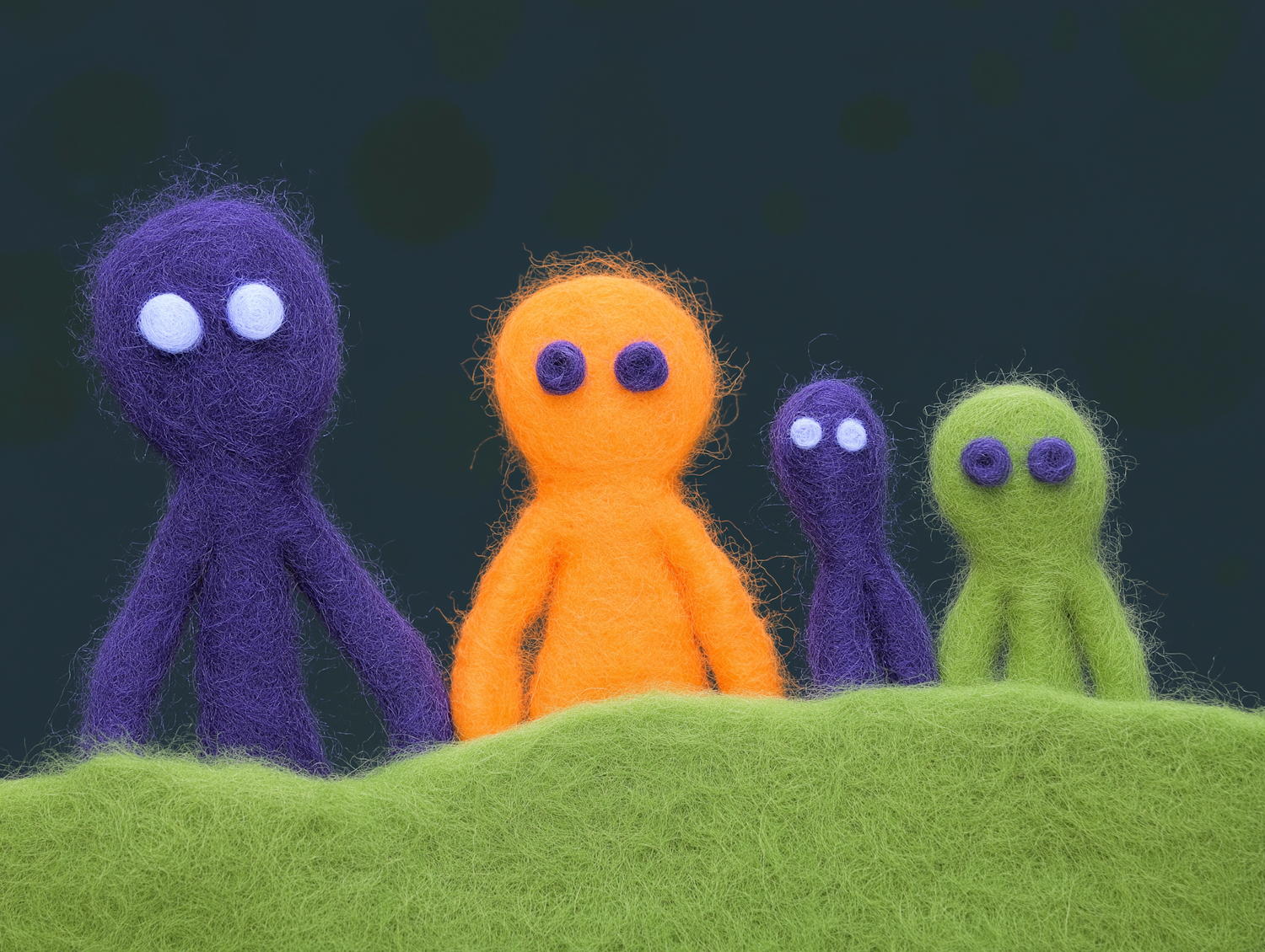 Felted Figures on Green Surface