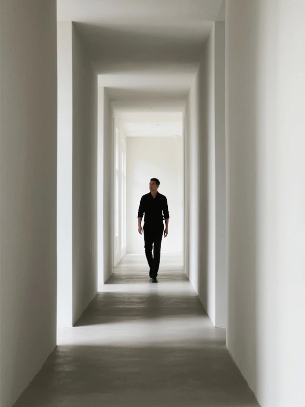 Man in Minimalist Corridor