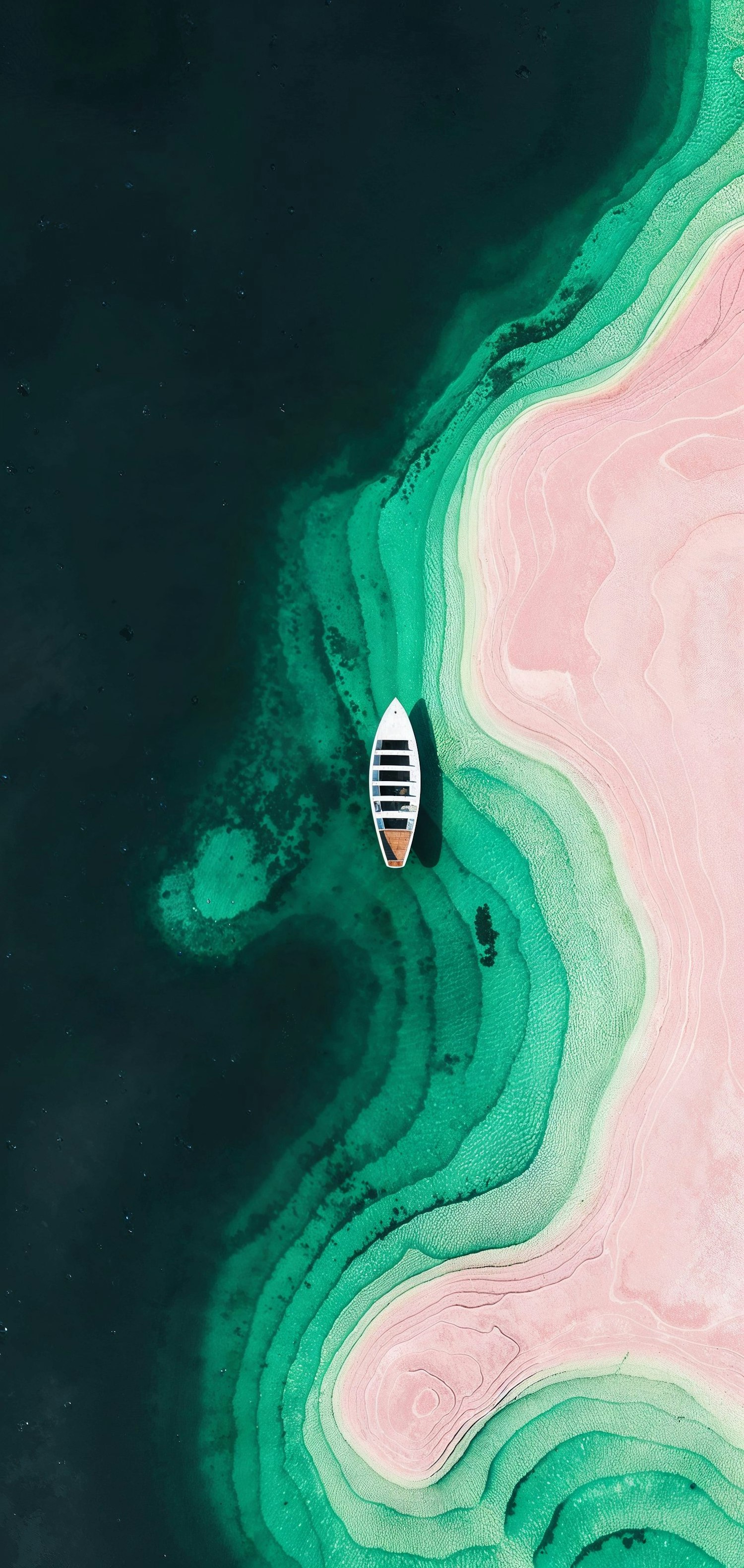 Aerial View of a Boat on Colorful Water