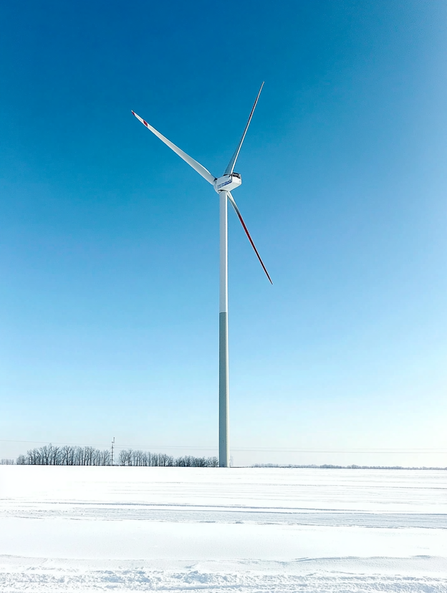 Solitary Wind Turbine in Snowy Landscape