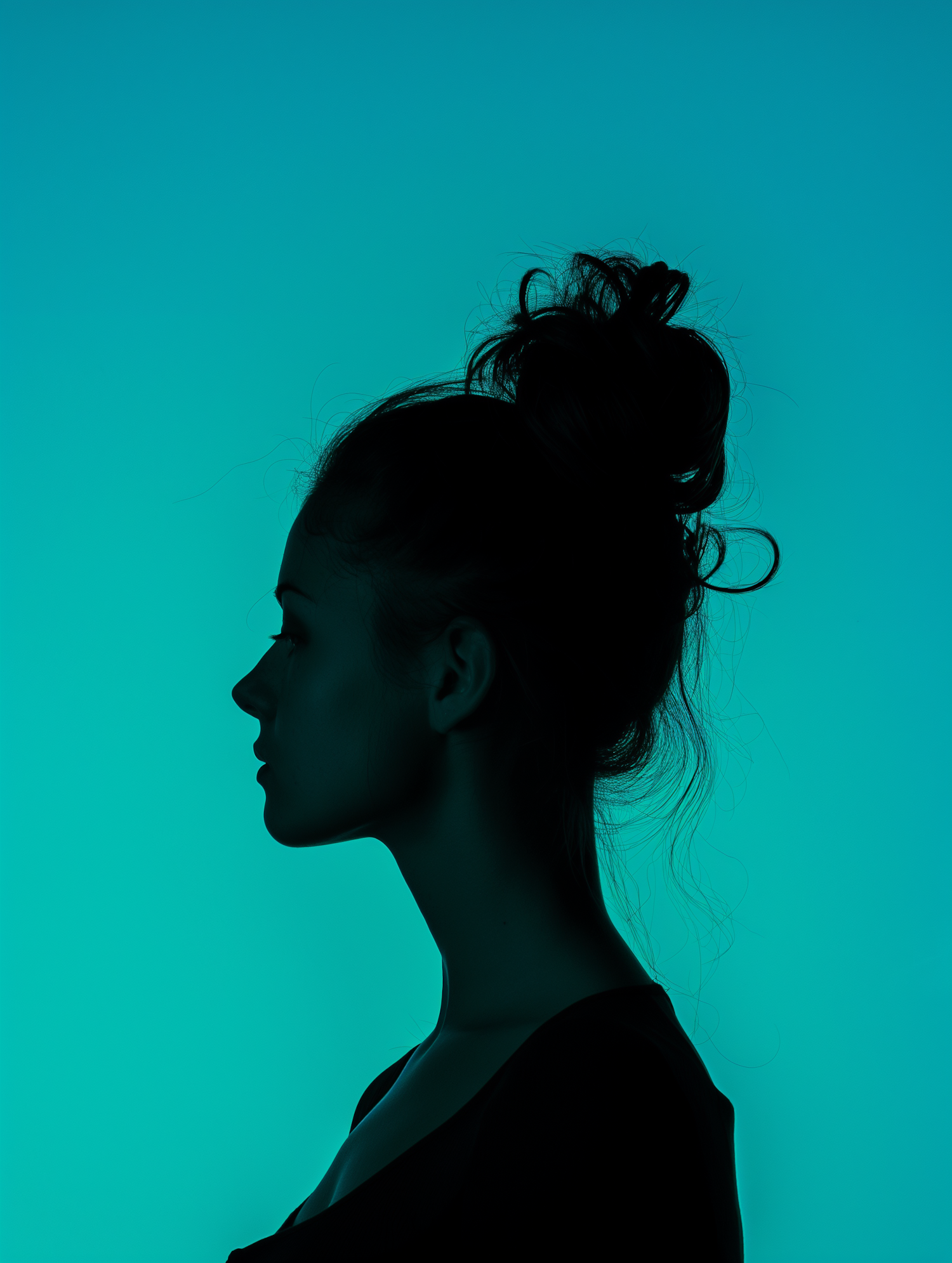 Silhouette of a Woman with Teal Background
