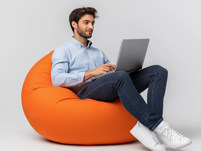 Man on Orange Bean Bag with Laptop