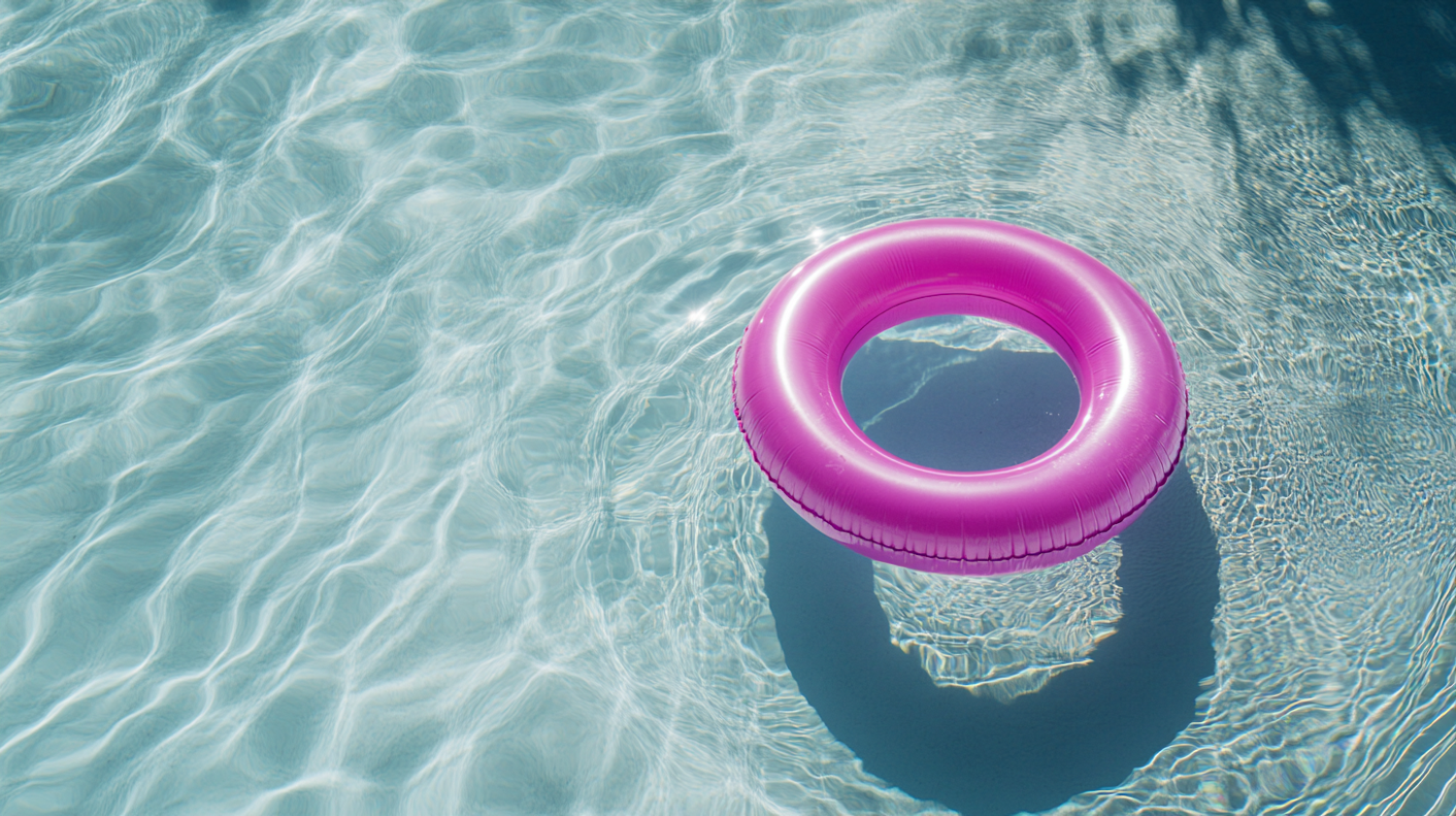 Pink Inflatable Ring in Pool