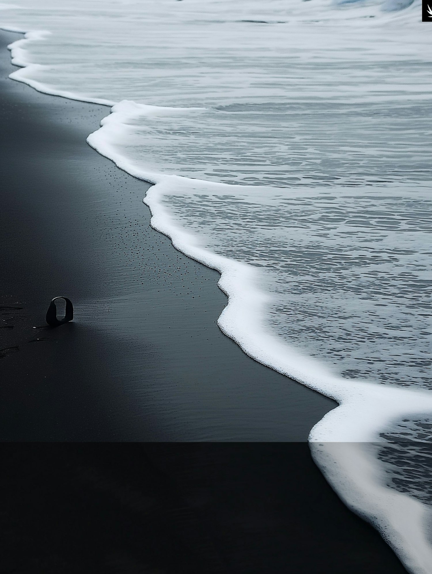 Serene Beach and Volcanic Sand