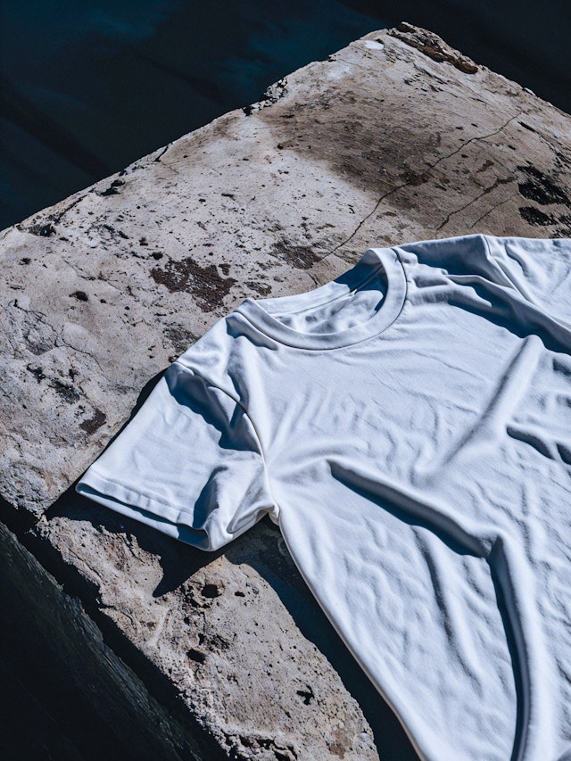 White T-shirt Mockup on a Rock