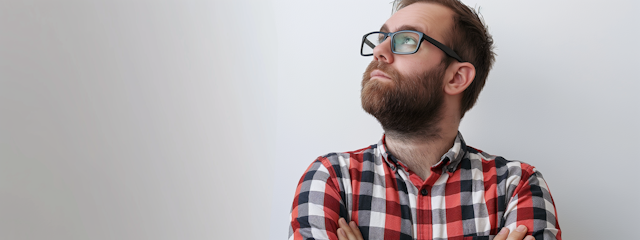 Thoughtful Man in Checked Shirt