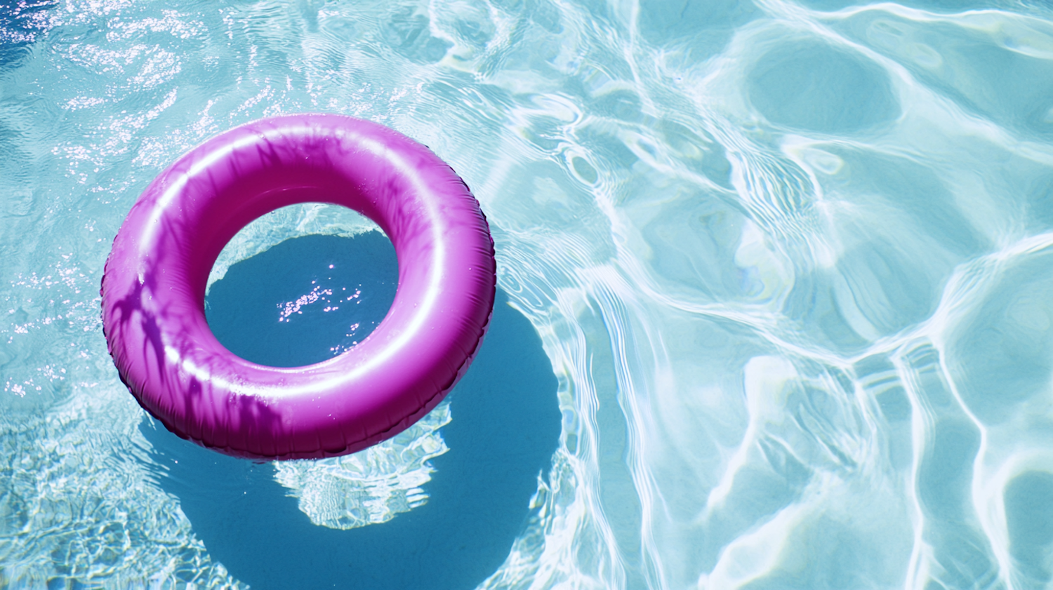 Pink Inflatable Ring in Pool