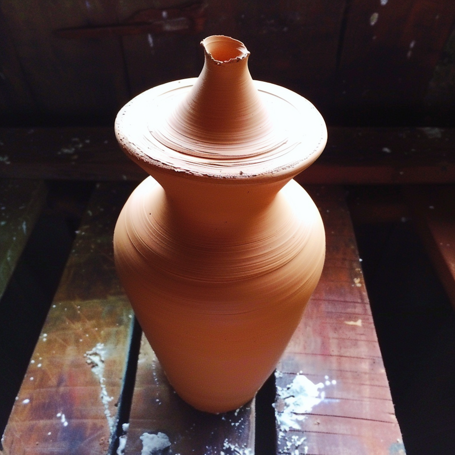 Unfinished Clay Pot on Pottery Wheel