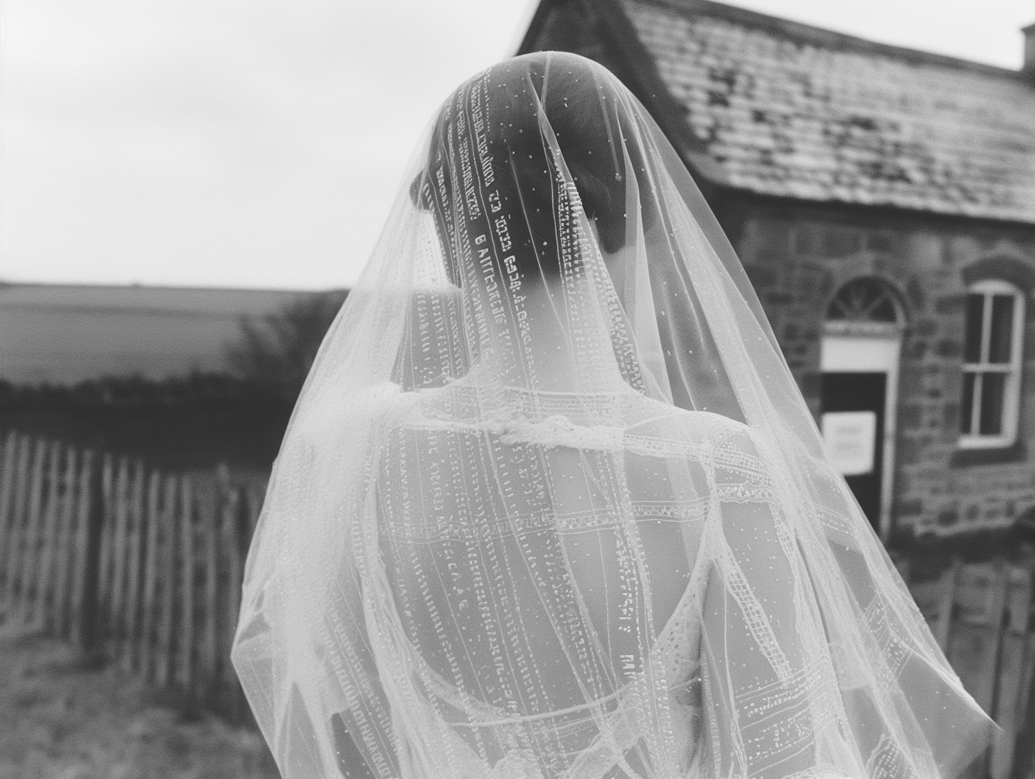 Contemplative Bride in Embroidered Veil