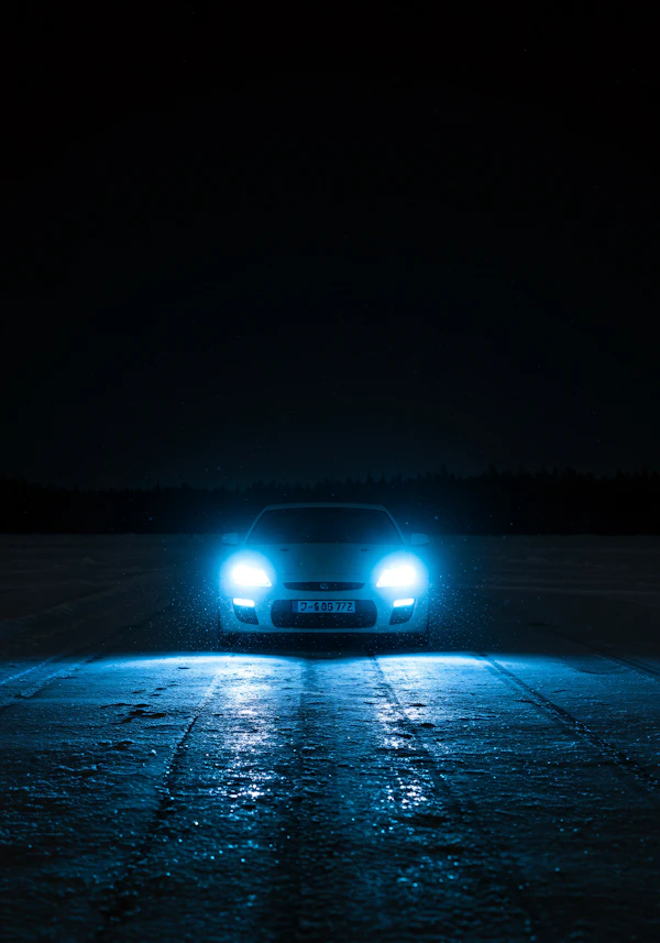 Car on Icy Night Road