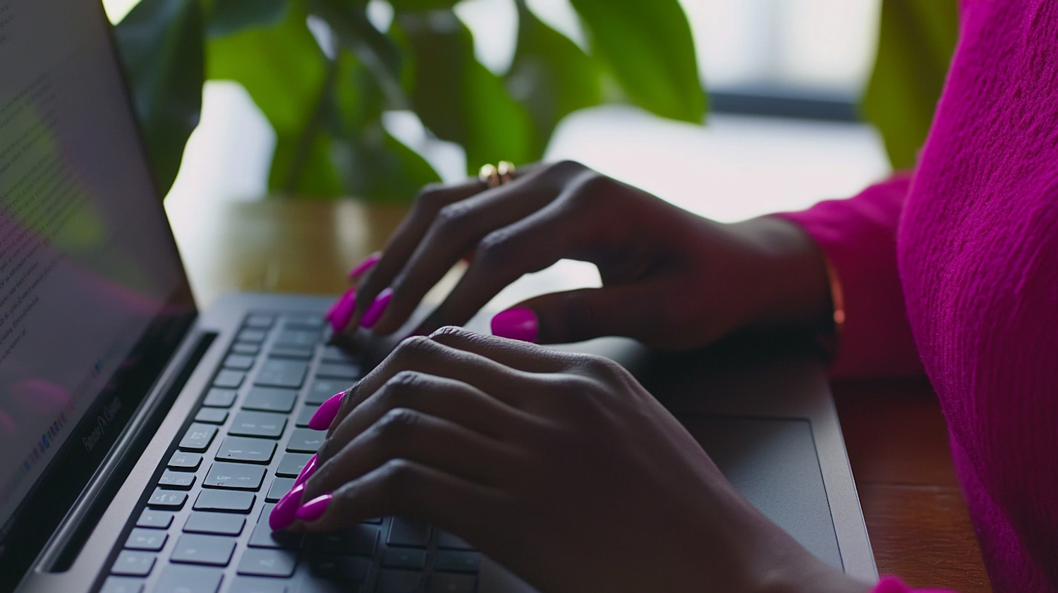 Hands Typing on Laptop